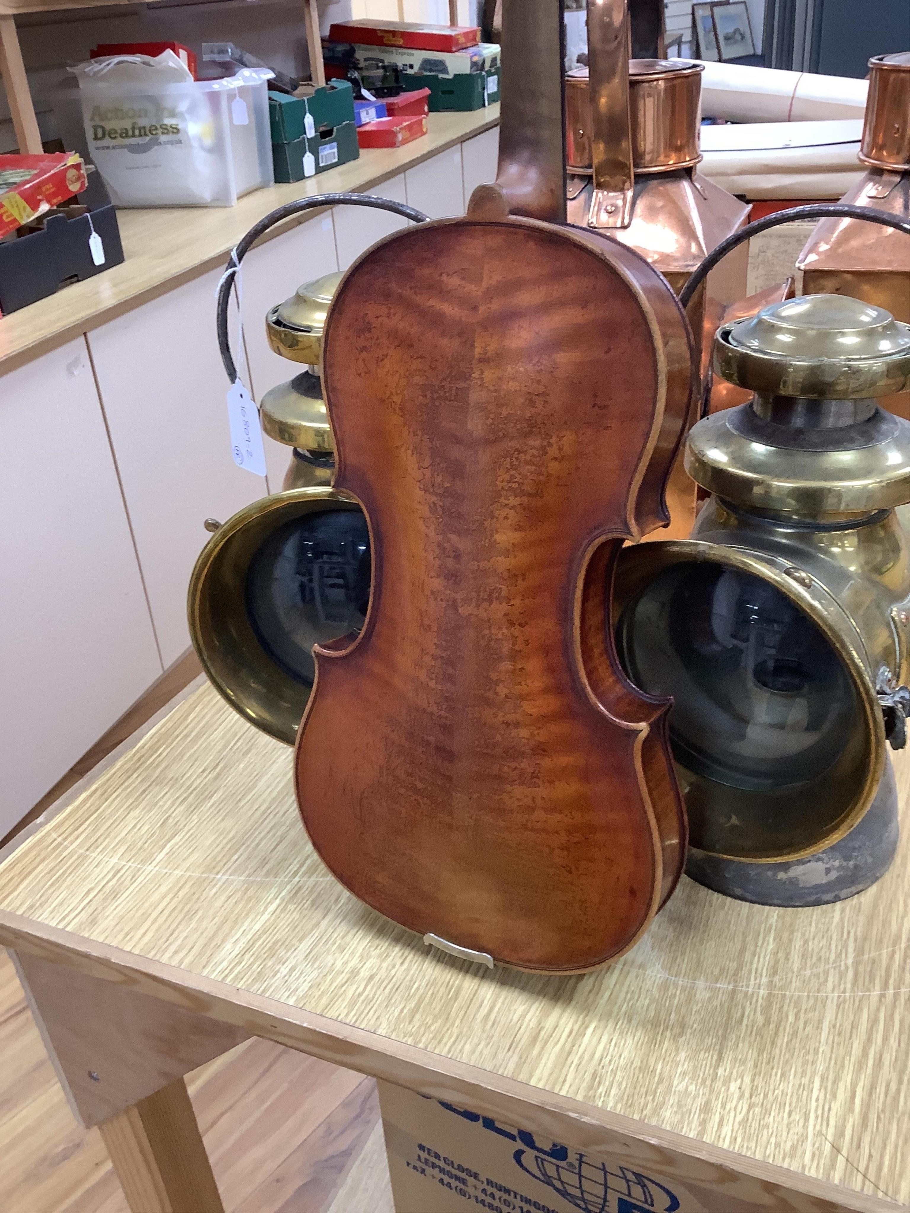 A late 19th cased century French unmarked violin and bow, body 35cm high.